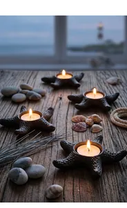 Detailed shot of starfish-shaped cast iron candle holders on weathered wood.