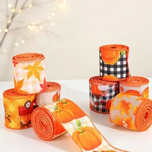 Detailed view of festive autumn burlap ribbons featuring pumpkin and maple leaf prints