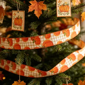 Detailed view of autumn harvest linen ribbon featuring pumpkin prints on a green pine tree