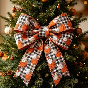 Autumn harvest pumpkin gingham bow decoration on a festive holiday tree detail