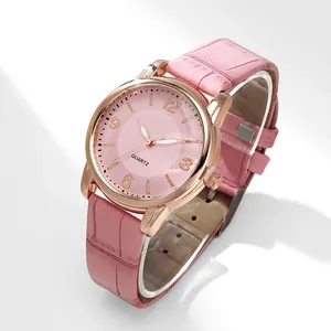 Detailed view of pink ladies quartz watch with crocodile pattern leather strap