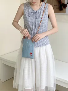 Small cute embroidered denim crossbody bag for women featuring colorful beaded shoulder strap.