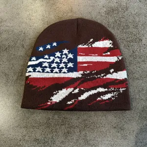 Brown knit beanie with distressed American flag jacquard design for winter warmth