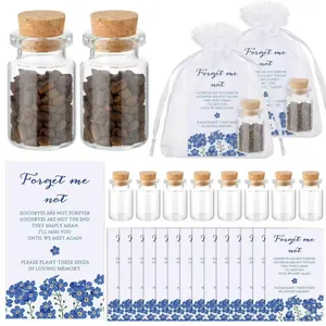 Detailed view of memorial seed bottles with Forget Me Not cards and organza bags.