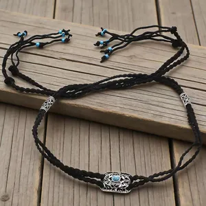 Handmade ethnic braided hair rope with turquoise beads and silver charms