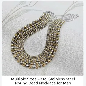 Detailed shot of various sized stainless steel round bead necklaces in gold and silver