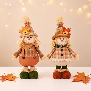 Thanksgiving harvest scarecrow dolls with plaid clothes and maple leaf hat decorations
