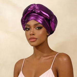 Detailed view showing a purple metallic turban with cross-front design on a model.