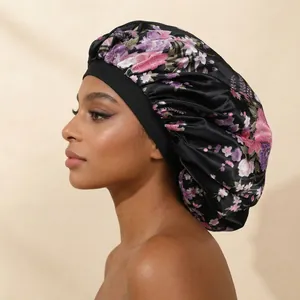Close-up of a floral print satin sleep bonnet with high elastic band on a model