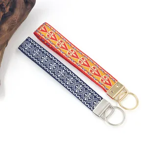 Ethnic style embroidered webbing keychains in red and blue patterns for bags