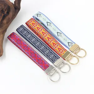 Four vibrant ethnic style embroidered webbing keychains featuring unique colorful patterns.