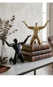 Artistic male muscle sculptures in distressed gold and matte black for Nordic home decor