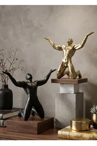 Artistic gold and black kneeling male figure sculptures for modern home interior decor