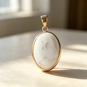 Elegant oval white howlite stone pendant with gold-plated bezel for necklaces