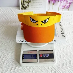 Detail of an orange and yellow sun visor hat weighing 54g on a digital scale