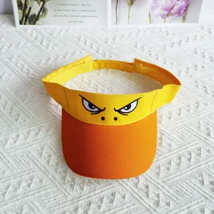 Detailed view of the funny embroidered angry eyes on the yellow sun visor hat.