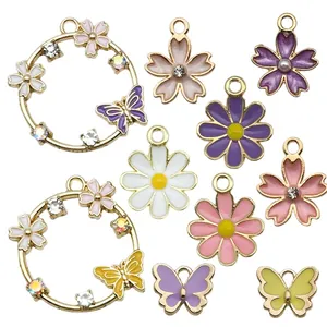 Collection of floral and butterfly enamel charms with rhinestones for DIY jewelry