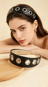 Detail view of black PU leather headband with stylish silver metal eyelets decoration