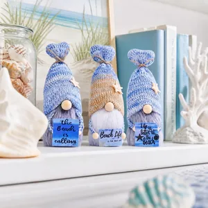 Detailed close-up of nautical knitted gnomes with beach signs and starfish decor