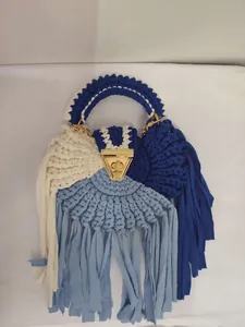 Handmade crochet semicircular tassel bag with contrast colors and gold chain strap