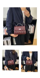 Détail du sac bandoulière tressé bordeaux avec fermoir rotatif argenté et chaîne