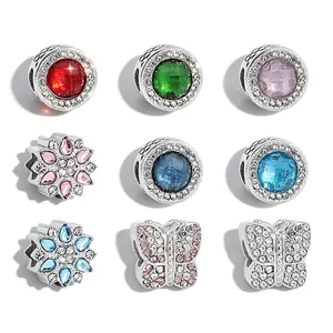Diverse stainless steel crystal charms for DIY bracelets with floral and butterfly designs