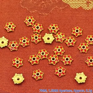 Close-up view of 7mm red enamel flower-shaped alloy bead spacers for DIY jewelry