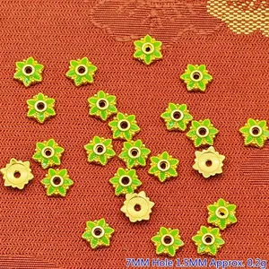 Close-up of 7mm green flower alloy spacer beads with 1.5mm hole for DIY jewelry.