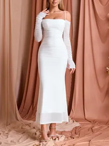 Detail view of an elegant white ruched mesh long sleeve off-the-shoulder bodycon dress.