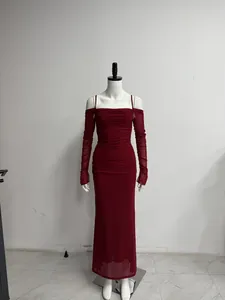 Detail view of the burgundy ruched mesh maxi dress featuring off-shoulder long sleeves