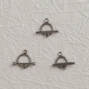 Detailed shot of three stainless steel OT toggle clasps for DIY jewelry making projects