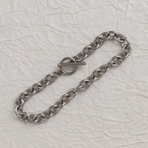 Detailed close-up of a polished stainless steel OT toggle clasp for jewelry making