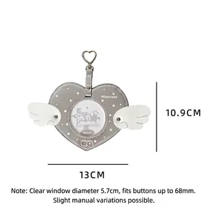 Detailed dimensions of silver heart-shaped badge protector with wings