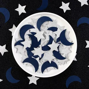 Sparkling silver glitter star and navy blue moon confetti for party table decorations