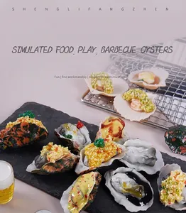 Realistic PVC simulated grilled oysters and scallops with various toppings on a slate.
