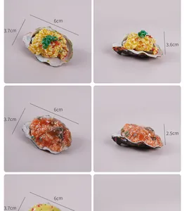 Detailed view of realistic PVC simulation oyster and scallop food model keychains for bags.