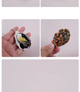 Detailed macro view showing realistic textures of simulated PVC oyster keychain model