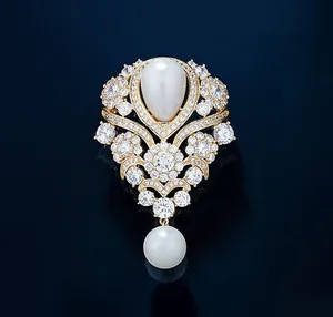 Detailed view of luxury French vintage brooch with water-drop pearl and sparkling rhinestones