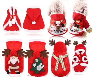 Collection of festive Christmas dog outfits including red velvet capes and reindeer hoodies.