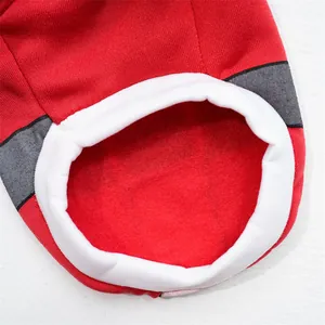 Close-up detail of soft fleece lining and knit fabric on red pet Christmas sweater