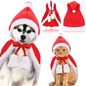 Detailed look at the Christmas pet cloak featuring a hood and white fur pom-poms