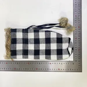 Measurement detail of black and white plaid Christmas wine bottle cover with faux fur trim