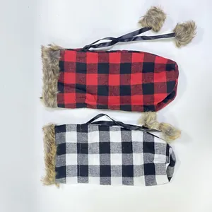 Buffalo plaid Christmas wine bottle covers with faux fur trim and decorative pom-poms