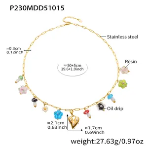 Detailed view of gold stainless steel necklace with colorful resin mushroom and heart charms