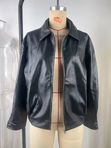 Detailed view of a vintage style black faux leather motorcycle jacket displayed on a mannequin.