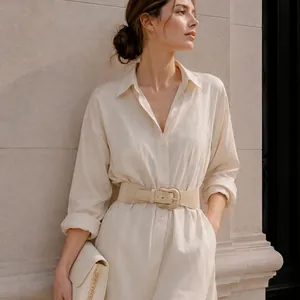 Close-up detail of a cream elastic waist belt styled elegantly on a matching shirt dress