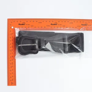 Detail view of black elastic waist belt for women's coat with measuring ruler scale