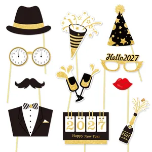 Glittery 2027 New Year photo booth props set on sticks for holiday party atmosphere
