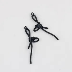 Vue détaillée de pendentifs nœuds papillon noirs en alliage pour bijoux DIY