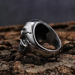 Detailed macro view of vintage polished stainless steel skull ring with cracked texture